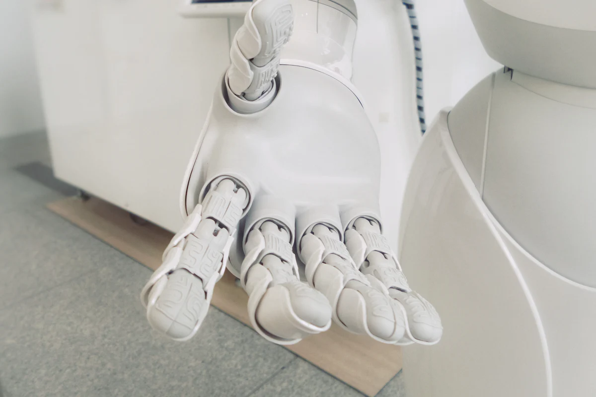 White robotic hand, a symbol of automated work